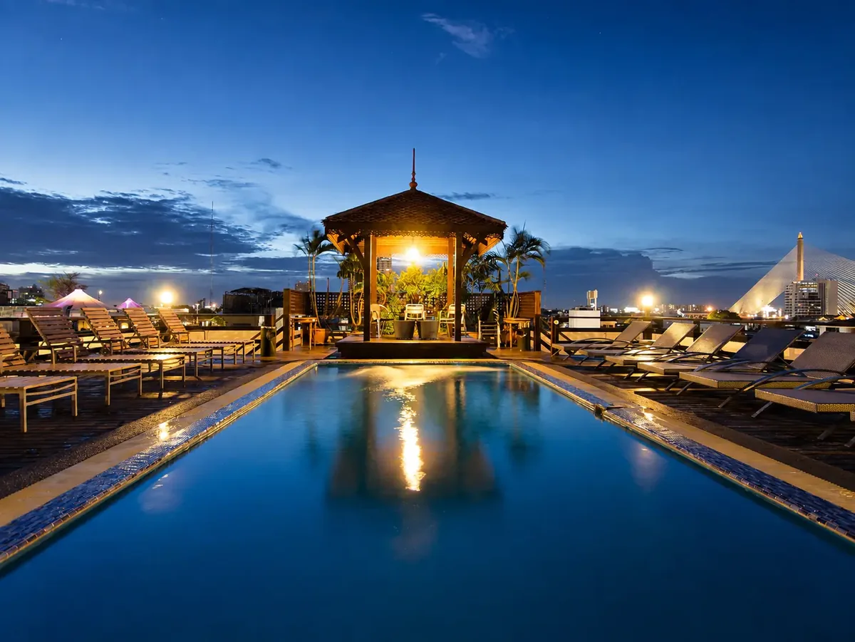 Rooftop swimming pool at Khaosan Palace Hotel at twilight